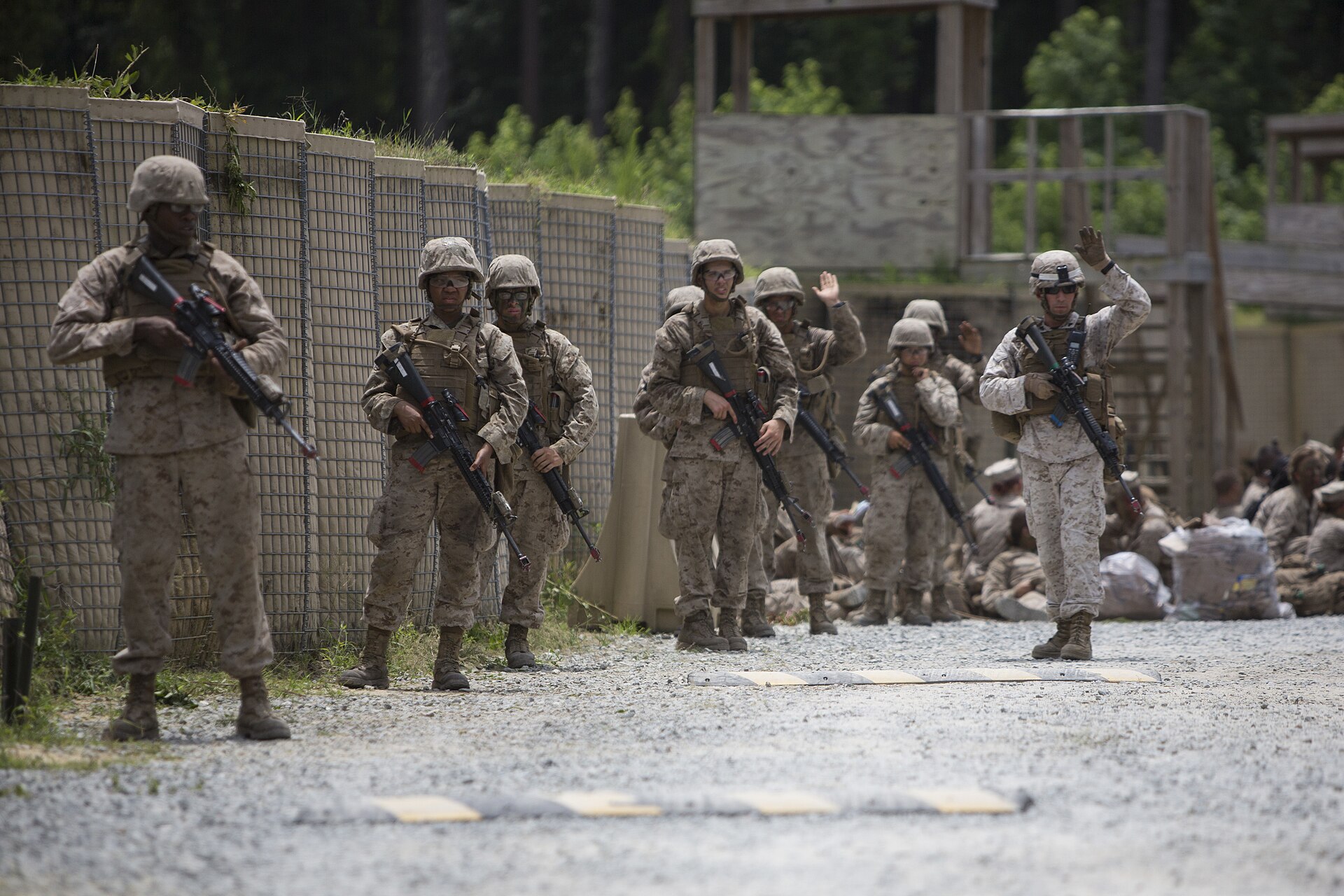 Instructor leading Marines on patrol during a field exercise